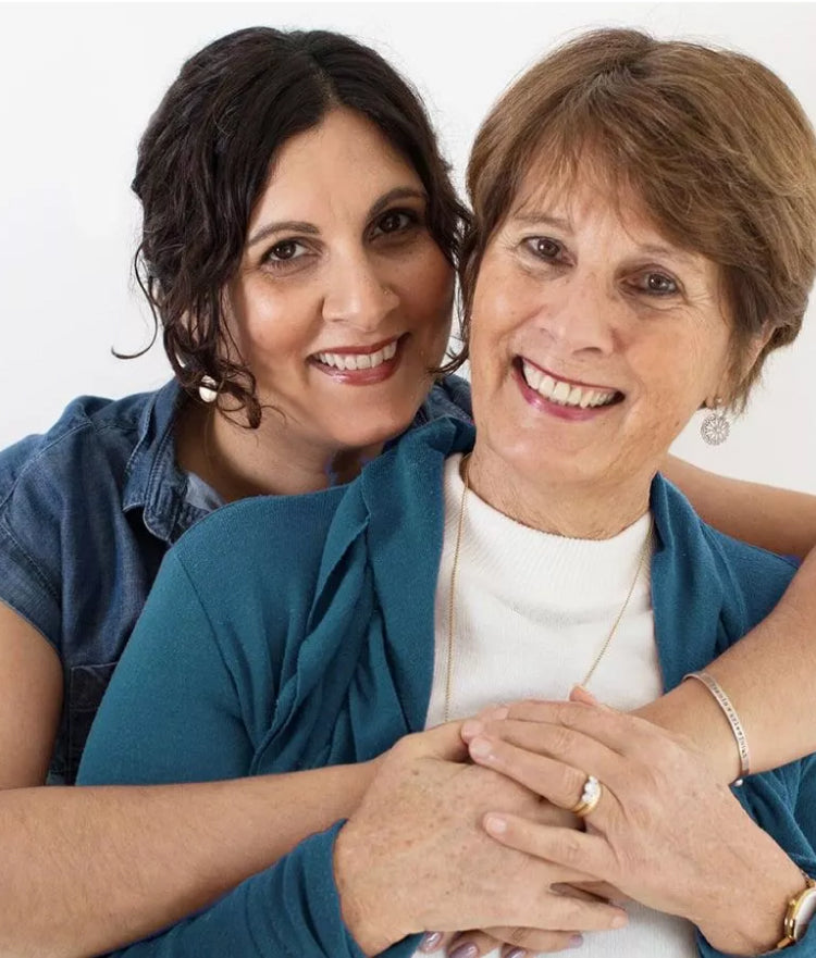 A daughter back hugging her mom