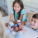 Kids probiotics gummies fiber gummies being offered by a mom to her children