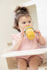Hello Sunshine Happy Sippy Cup by Bella Tunno being used by a toddler