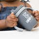 Sip Sip Hooray Happy Sippy Cup by Bella Tunno being held by a girl kid