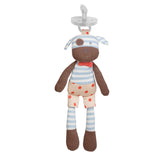 A brown toy in blue and white stripe clothes and a pink bow with a pacifier on top of it