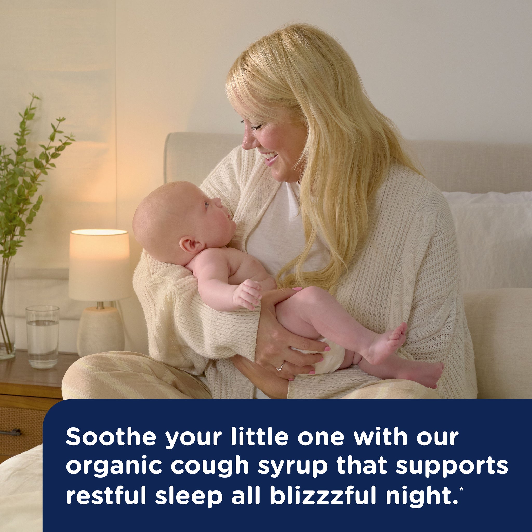 Mommy's Bliss Organic Baby Cough Syrup and Mucus Nighttime shown in an everyday lifestyle photograph