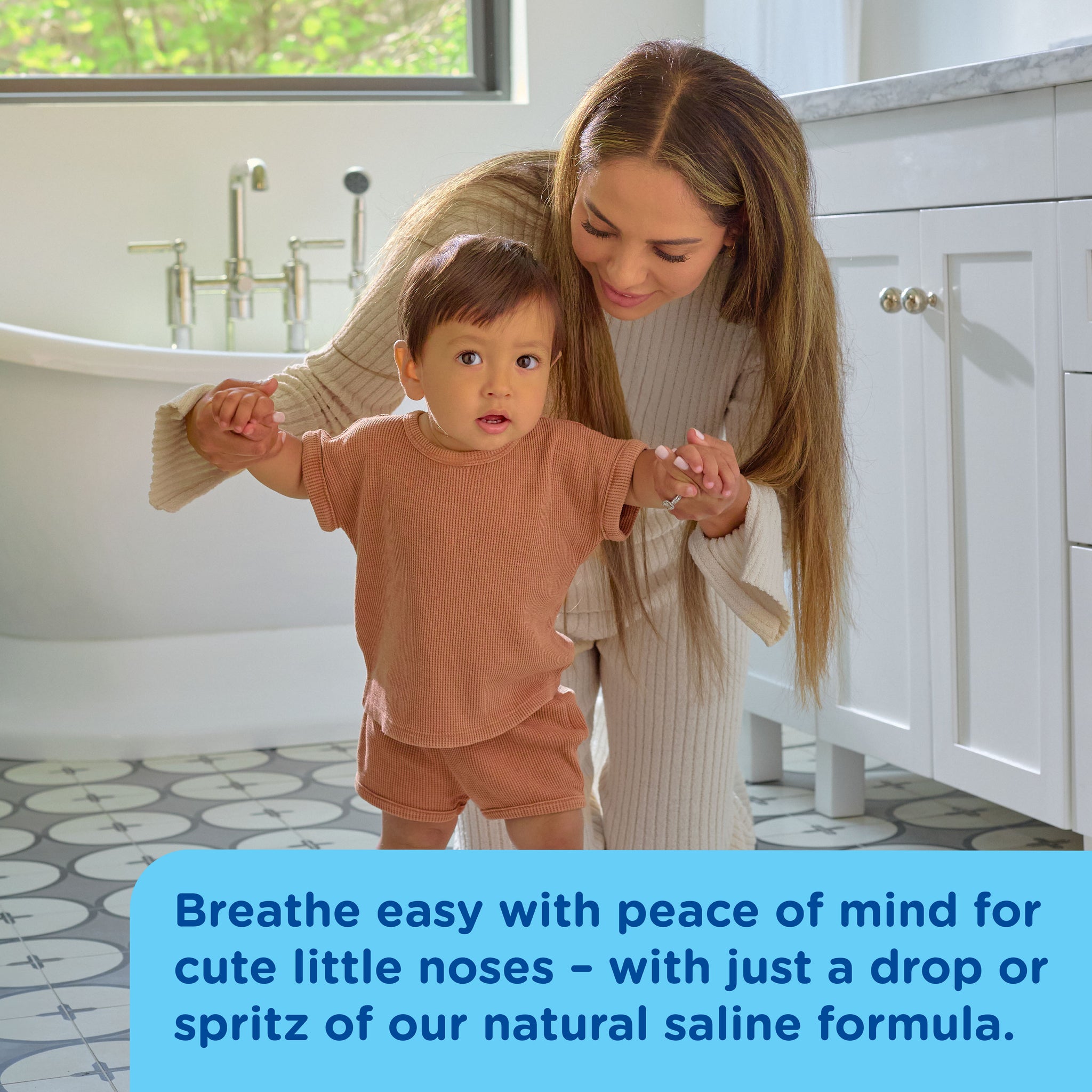 Mommy's Bliss Baby Saline Drops and Spray shown in an everyday lifestyle photograph