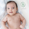 A smiling baby lying down with a white and green text