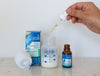 Probiotic Drops Skin Support being dropped in a baby bottle
