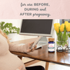Prenatal Multivitamin + Iron on top of the table with a pregnant mom